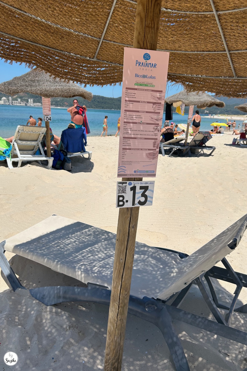 relaxing-vacation-troia-portugal-beach-07 Beach lounger and sun umbrella on the sand during a relaxing vacation in Troia Portugal