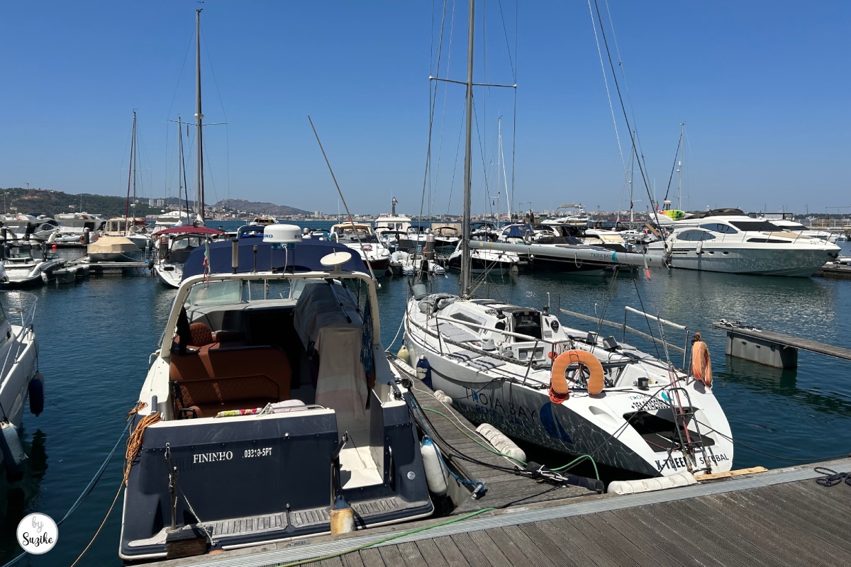 Boats docked at the marina during a relaxing vacation in Troia Portugal