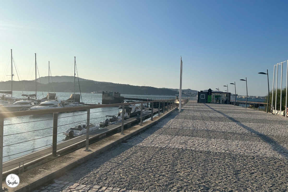 relaxing-vacation-troia-portugal-city-05 Marina walkway with boats and sunset light during a relaxing vacation in Troia Portugal