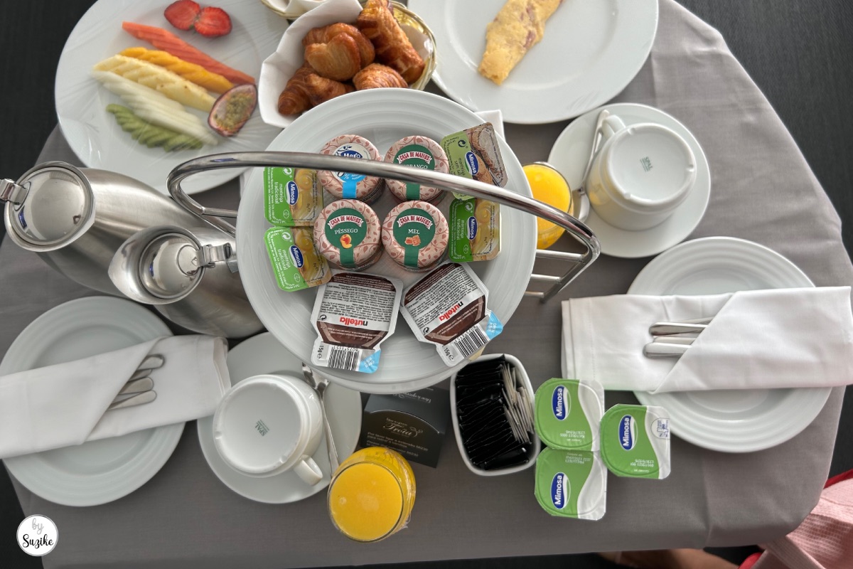 relaxing-vacation-troia-portugal-hotel-02 Hotel breakfast table with fruit pastries coffee and yoghurt during a relaxing vacation in Troia Portugal