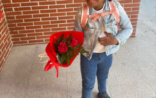 Child holding flowers for her mom, in a reflection about being both mom and dad