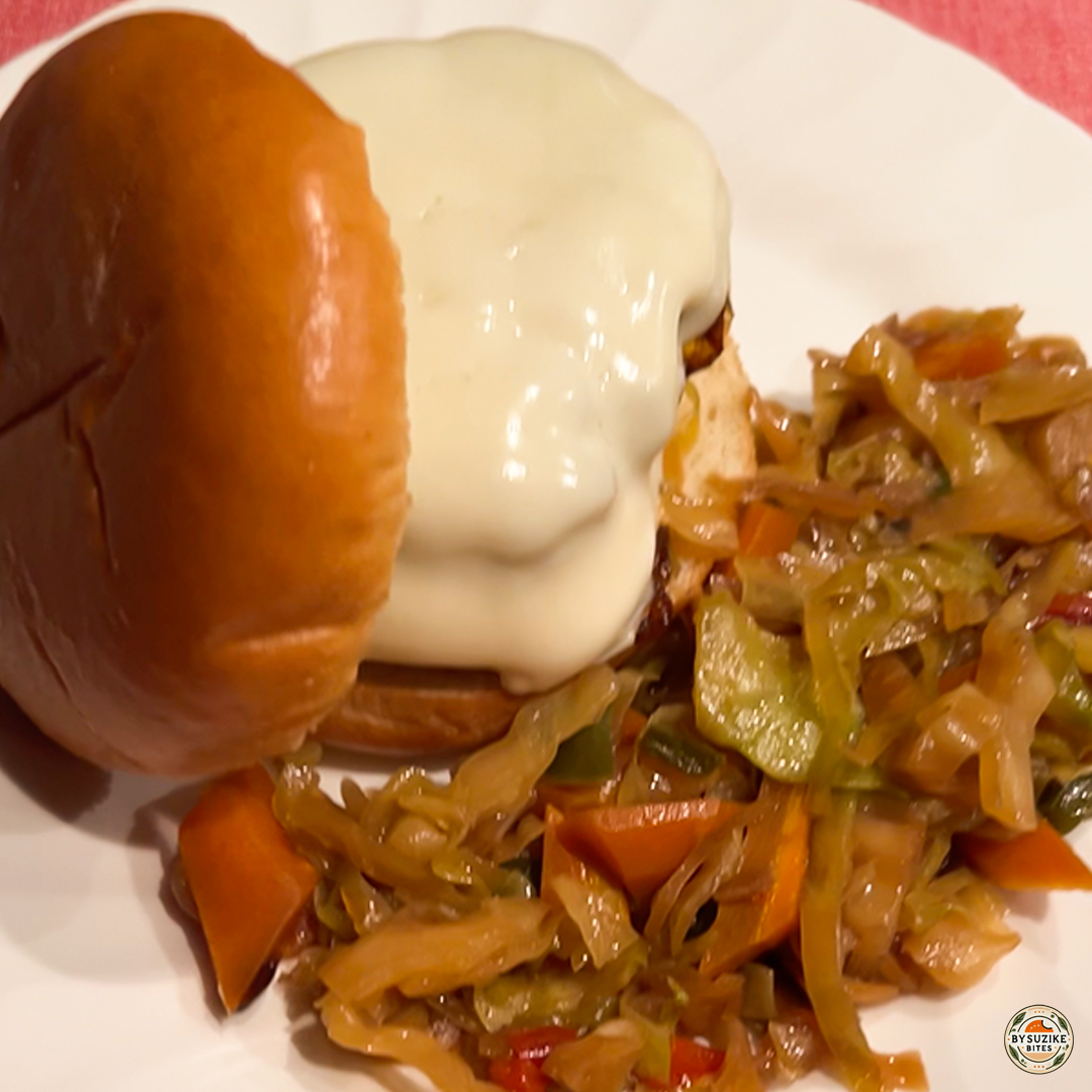 Homemade double cheeseburger with sautéed vegetables