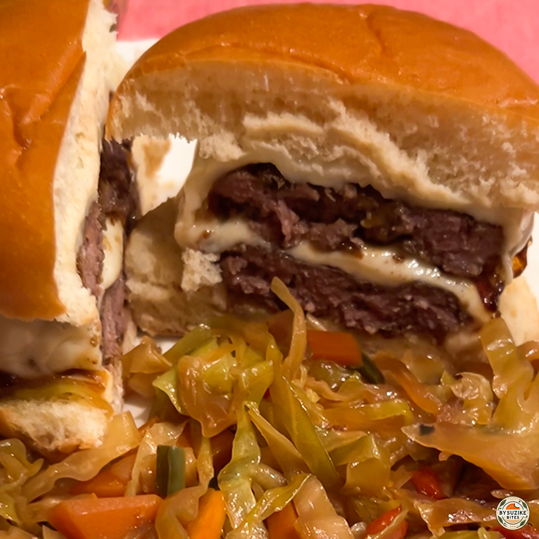 Homemade double cheeseburger with sautéed vegetables