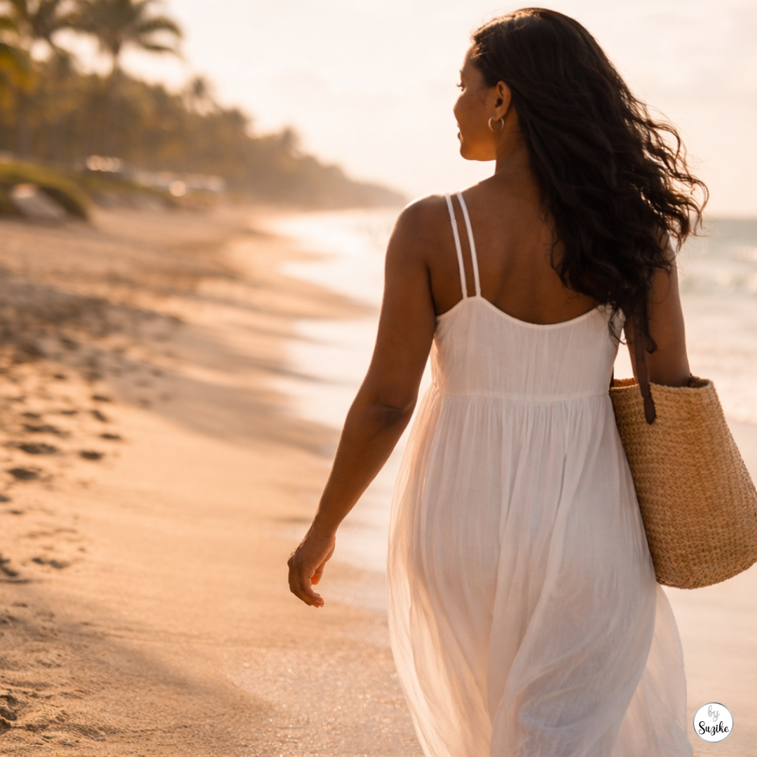 Black woman walking alone on a beach in a flowing dress, symbolising how to stop chasing someone and move forward with self-respect