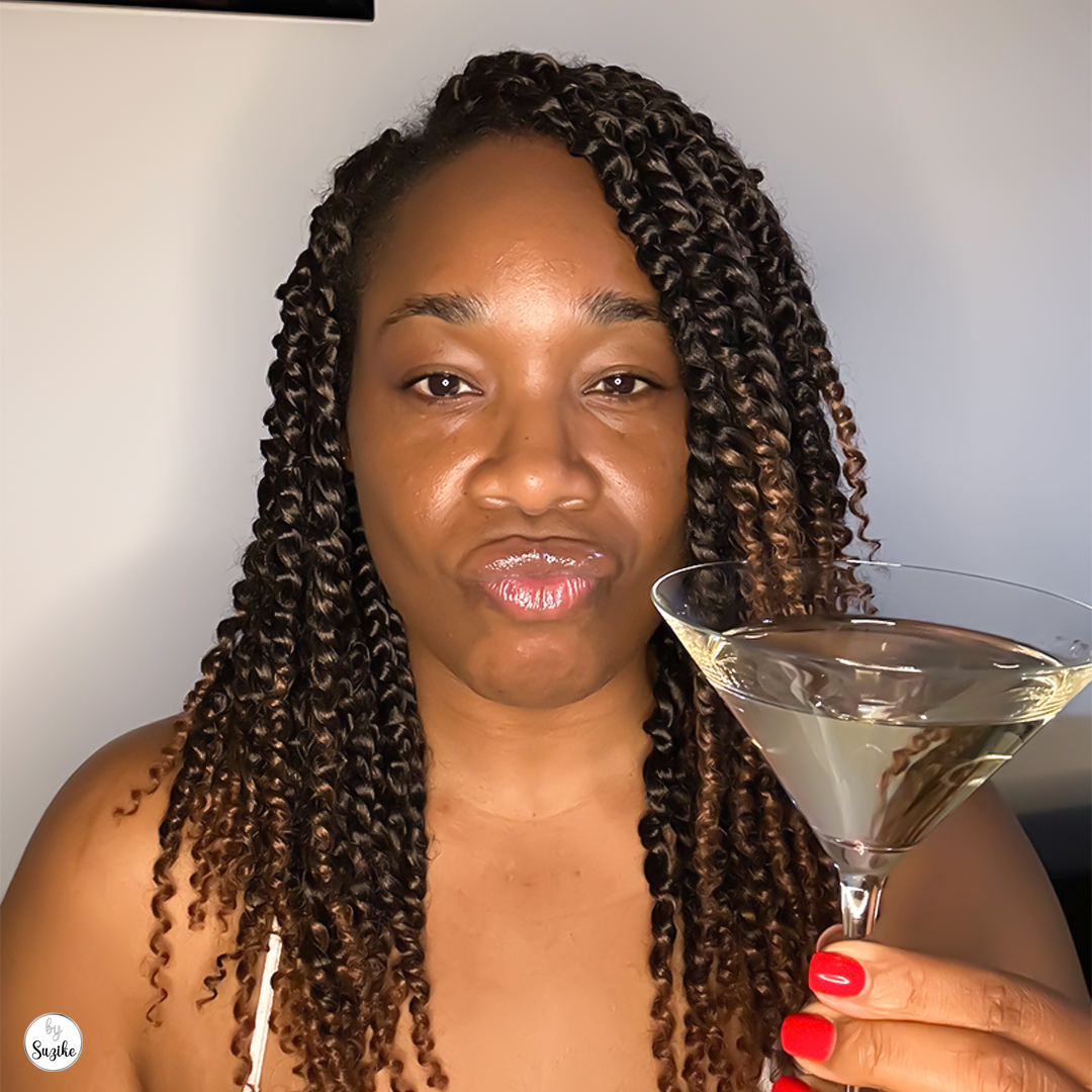 Me Time | The Fantasy vs. The Man 1 A woman drinking a martini while watching Mad Max: Fury Road, reflecting on a disappointing relationship.