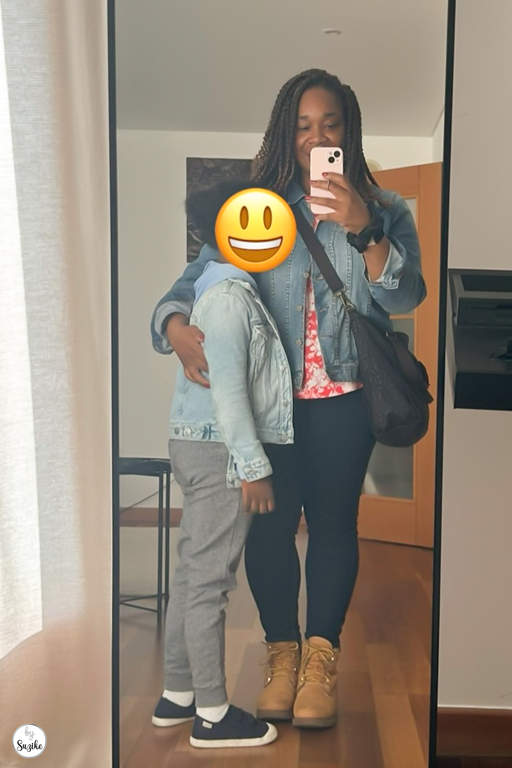 Mother and daughter dressed in casual outfits, ready for a shopping day. Mom is wearing Timberland boots, black leggings, a denim jacket, and a crossbody Kipling bag. Daughter wears gray pants, a denim jacket, and navy sneakers.