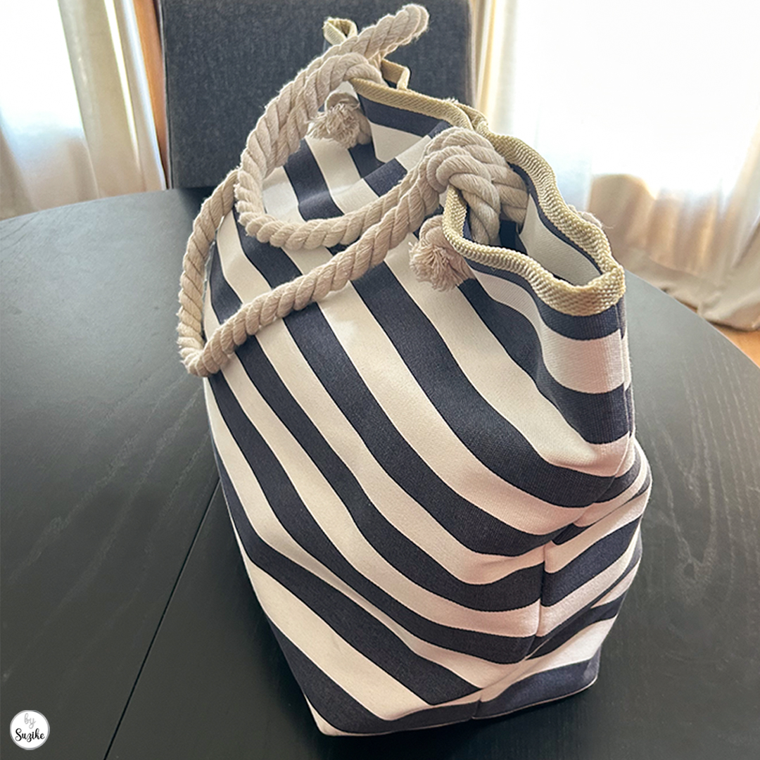 Side view of navy and white striped beach bag showing sturdy rope handles and spacious design – beach bag for moms