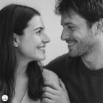 The way he looks at her is one of the signs he loves you without saying it, their smiles and eye contact reveal deep affection.