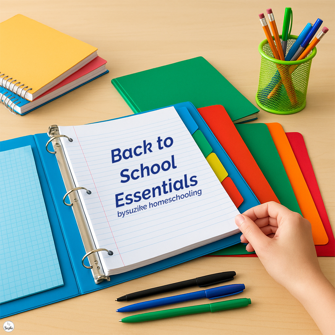 Back to school essentials for homeschooling — binder with lined and grid loose-leaf paper, colorful dividers, and pens organized on a desk.