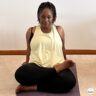 Suzike practicing yoga at home during her real-life fitness journey