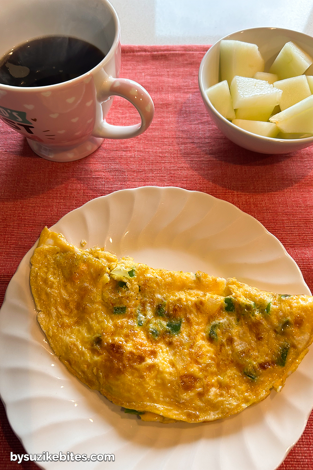 Healthy breakfast plate with omelette, black coffee and fresh fruit, part of Day 4 of my weight loss journey.