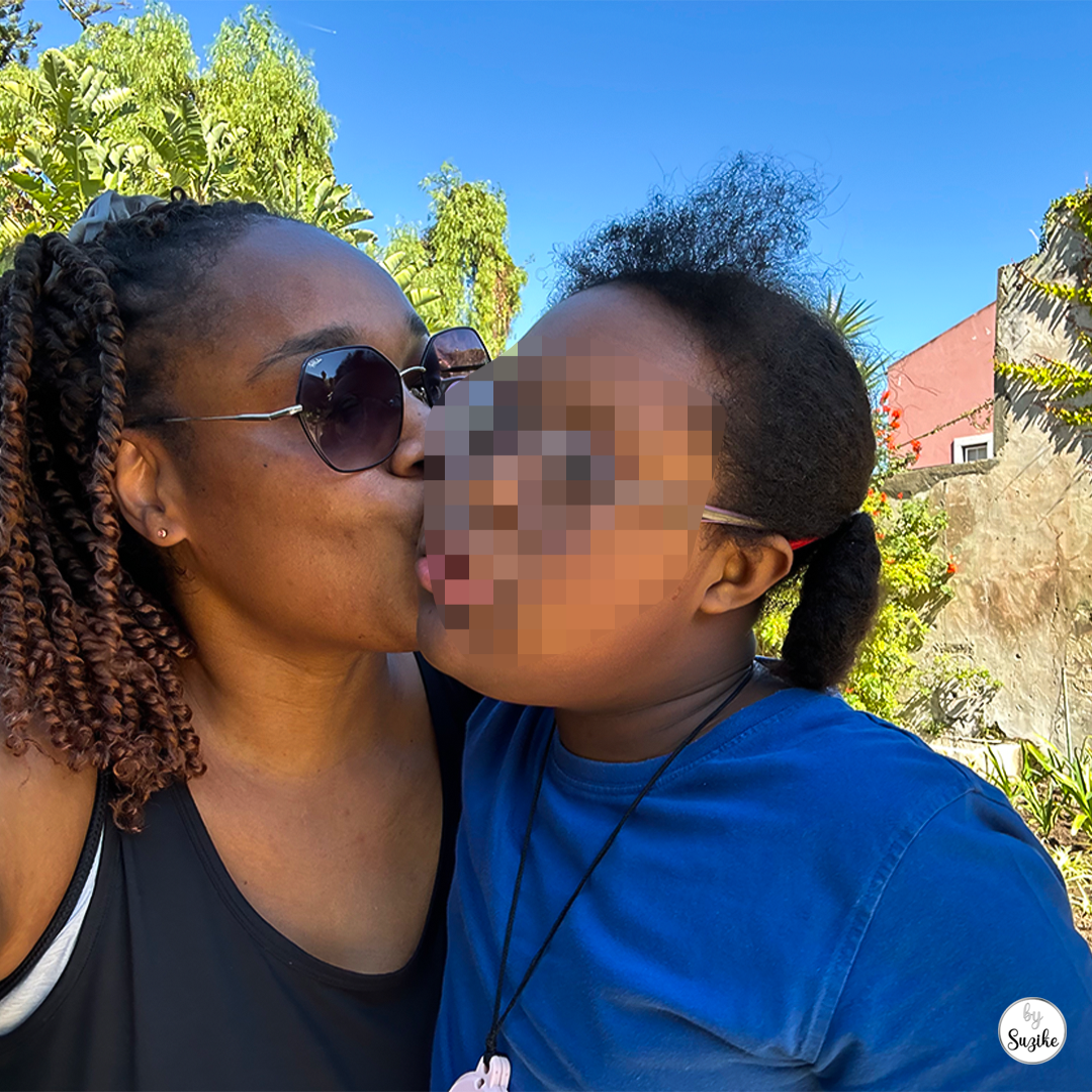 Mom and daughter selfie at the park in sunny weather, a warm bonding moment after a no equipment outdoor workout with walking and stairs.