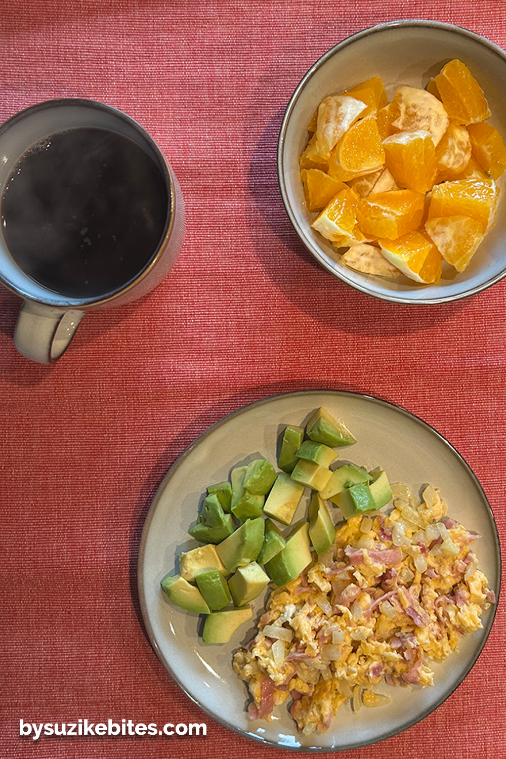 Weight loss journey Day 17: low-carb breakfast with scrambled eggs, avocado, orange slices, and black coffee — a simple and nutritious start to the day.