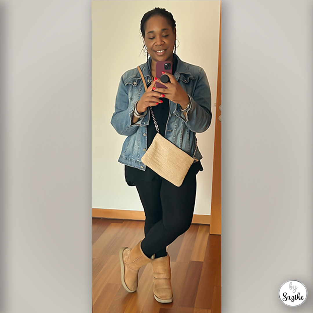 Full-length mirror photo of Suzike in a denim jacket, neutral bag and winter boots.