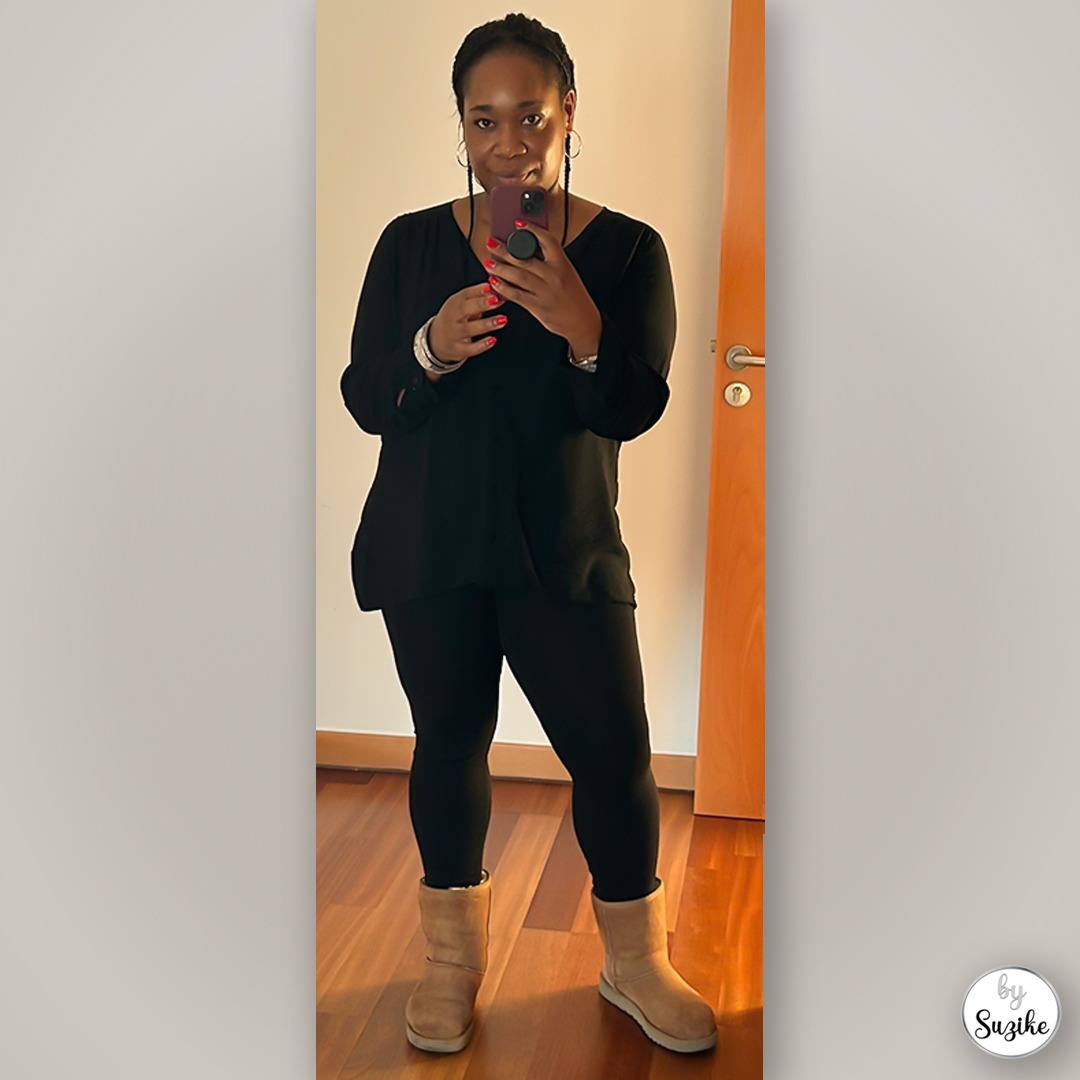 Black casual outfit with leggings and beige boots, perfect for errands and shopping day.