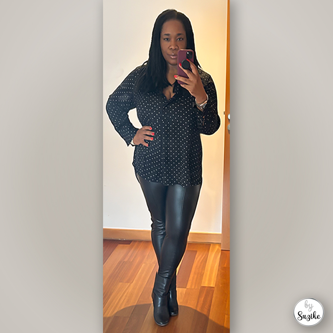 Simple winter outfit featuring black top, leather leggings and Fly London boots, photographed in a mirror