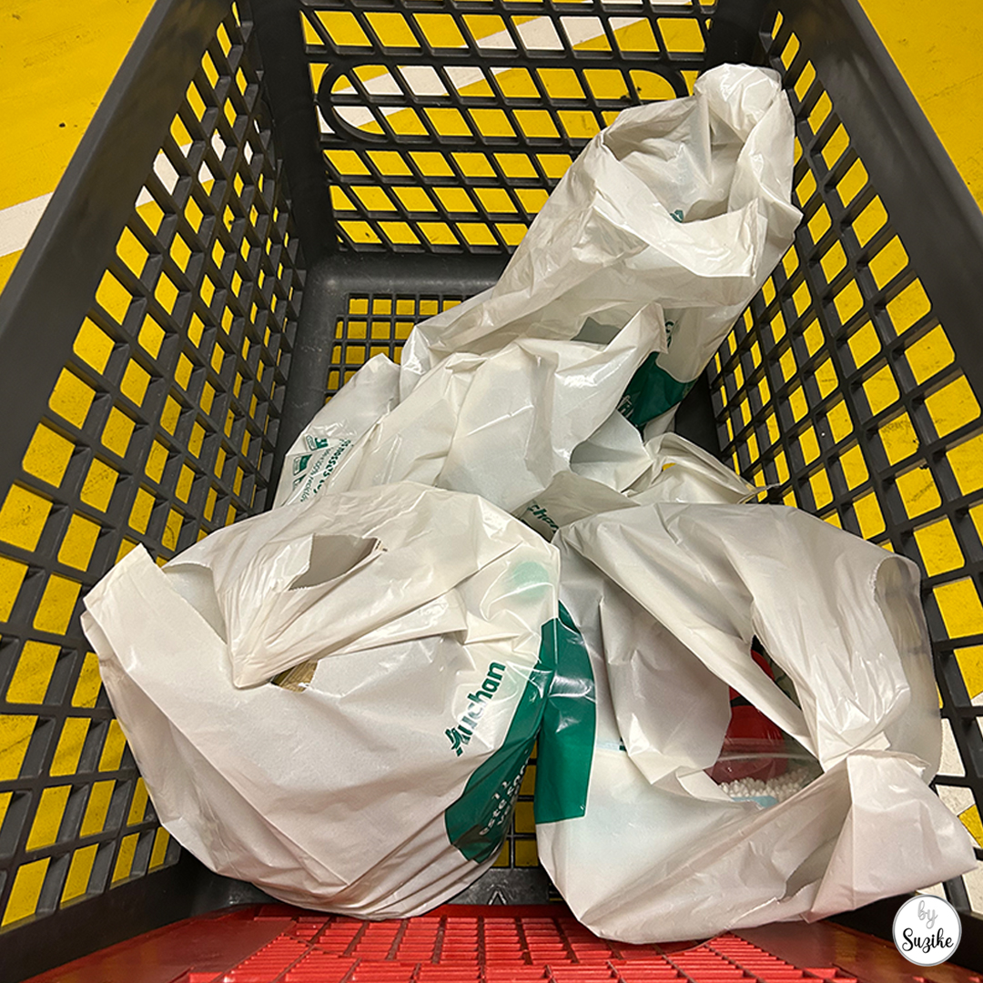 grocery bags inside a shopping cart during online pickup