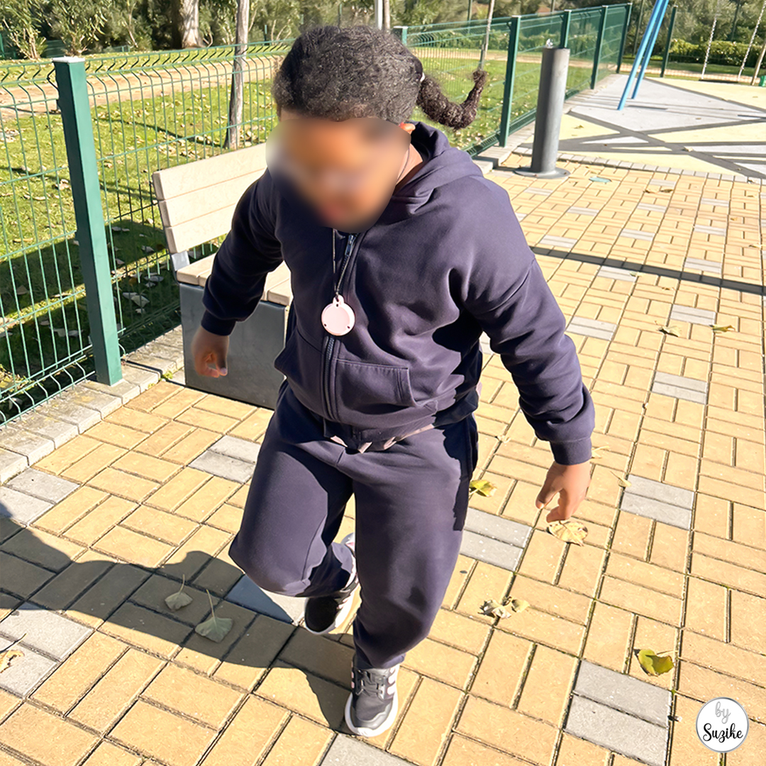child walking towards the camera at the playground