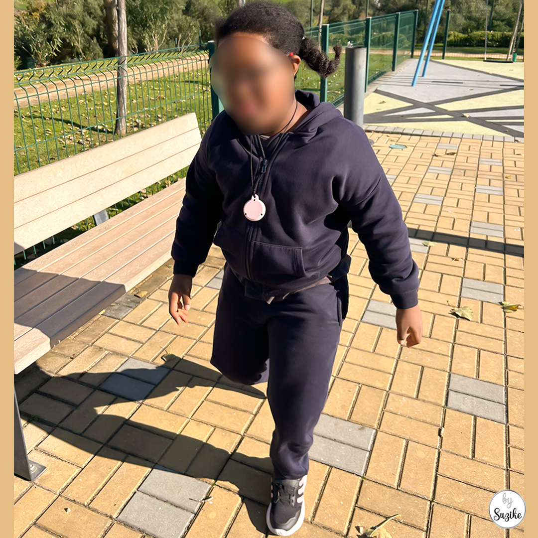 child walking at the park on a mild sunny morning