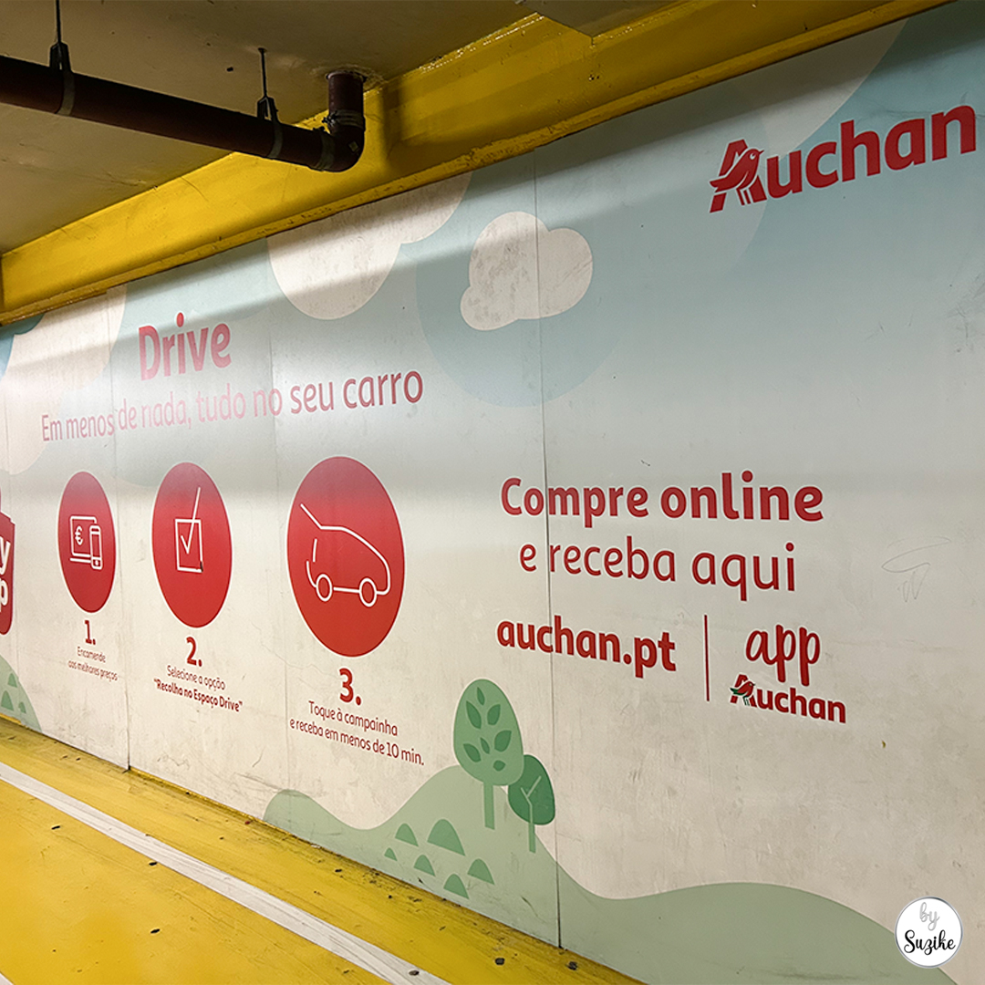 Auchan drive pickup instructions displayed on the wall