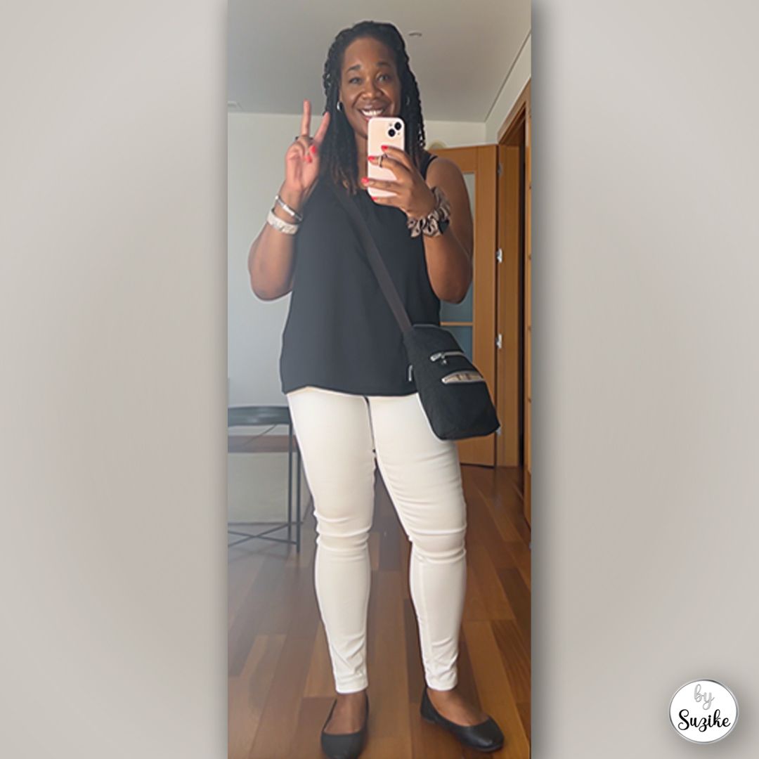 Suzike wearing a black top and white pants outfit simple comfortable and real life look 2