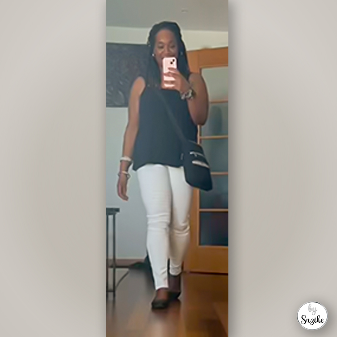 Suzike wearing a black top and white pants outfit simple comfortable and real life look 1