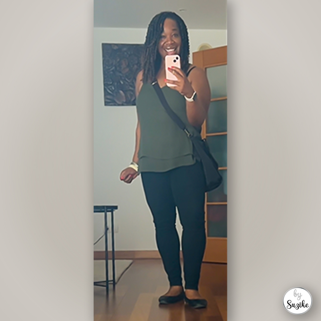 Everyday green sleeveless top styled with black skinny pants and flats, photographed indoors as a practical outfit idea.