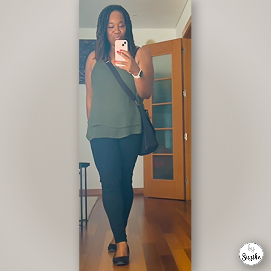 Green top and black pants outfit for busy mornings, shown in a mirror selfie with a black crossbody bag.