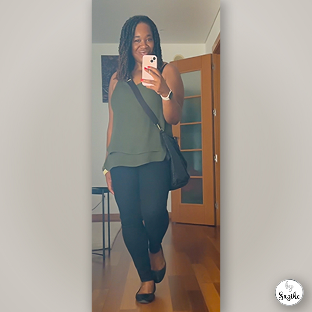 Casual green top paired with black pants and flats, real-life simple outfit captured in a full-body mirror photo.