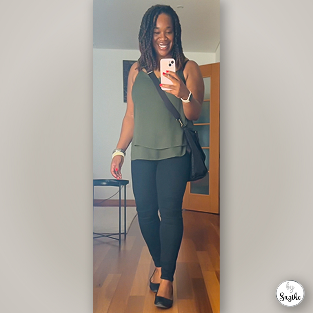 Casual green top paired with black pants and flats, real-life simple outfit captured in a full-body mirror photo.
