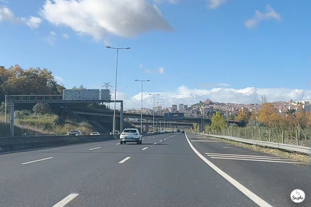 View of the highway on a sunny day as Suzike drives home after her quick grocery run.