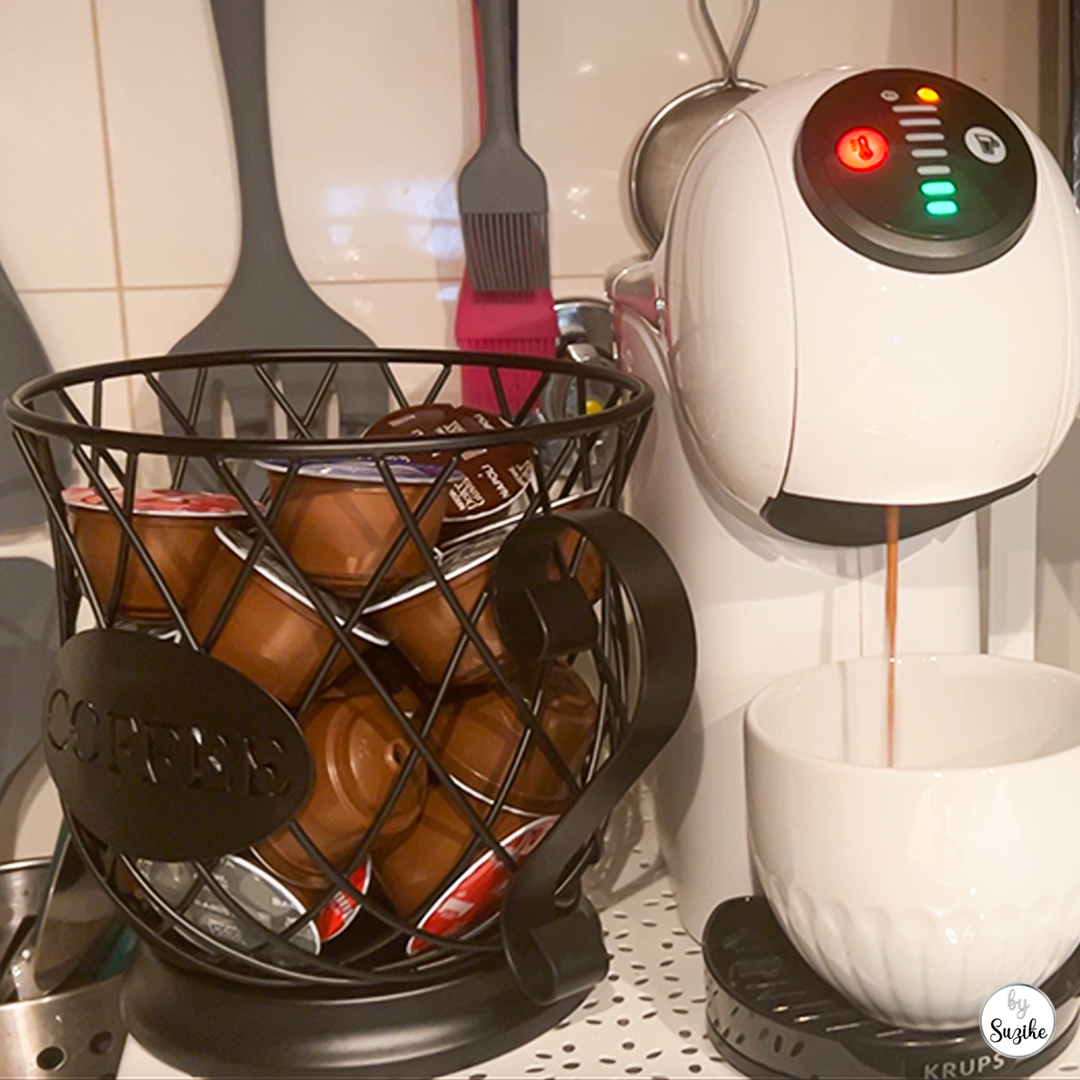 coffee pod holder on kitchen counter next to Dolce Gusto machine showing real-life daily use