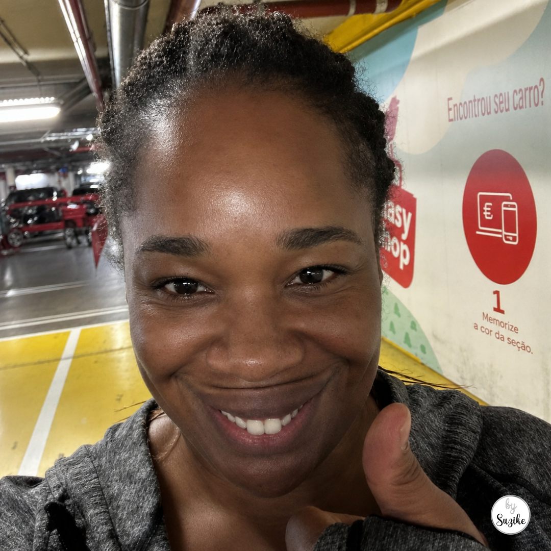 Online grocery pickup in Portugal with Suzike at an Auchan Drive pickup area after collecting groceries in Lisbon.