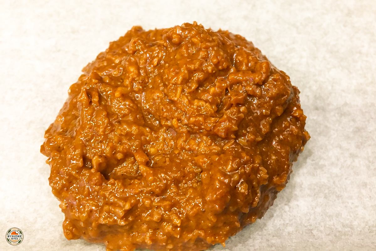 Single keto no bake cookie on parchment paper close up