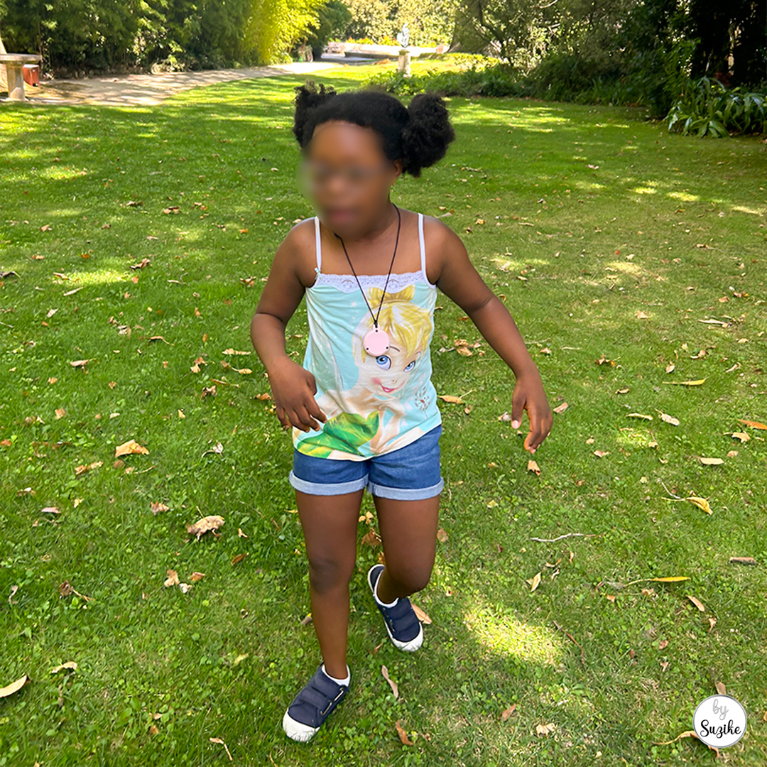 Felisberta standing on the grass in a sunny open area at Monteiro Mor Park and Theatre Museum.