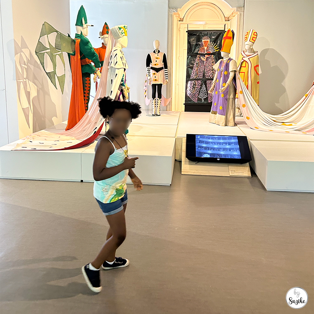 Felisberta walking inside the costume gallery at Monteiro Mor Park and Theatre Museum.