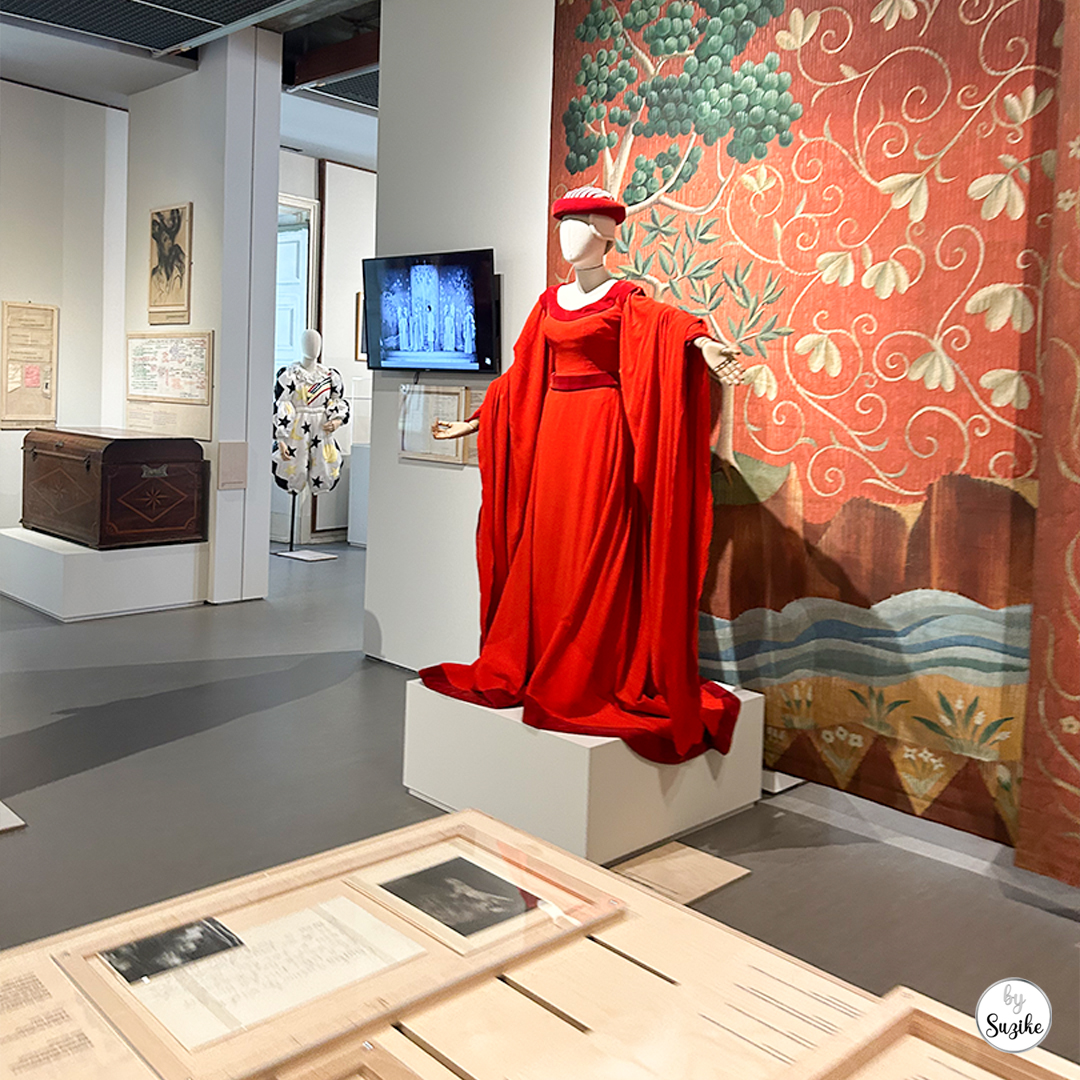 Red costume display in the Theatre Museum gallery at Monteiro Mor Park and Theatre Museum.