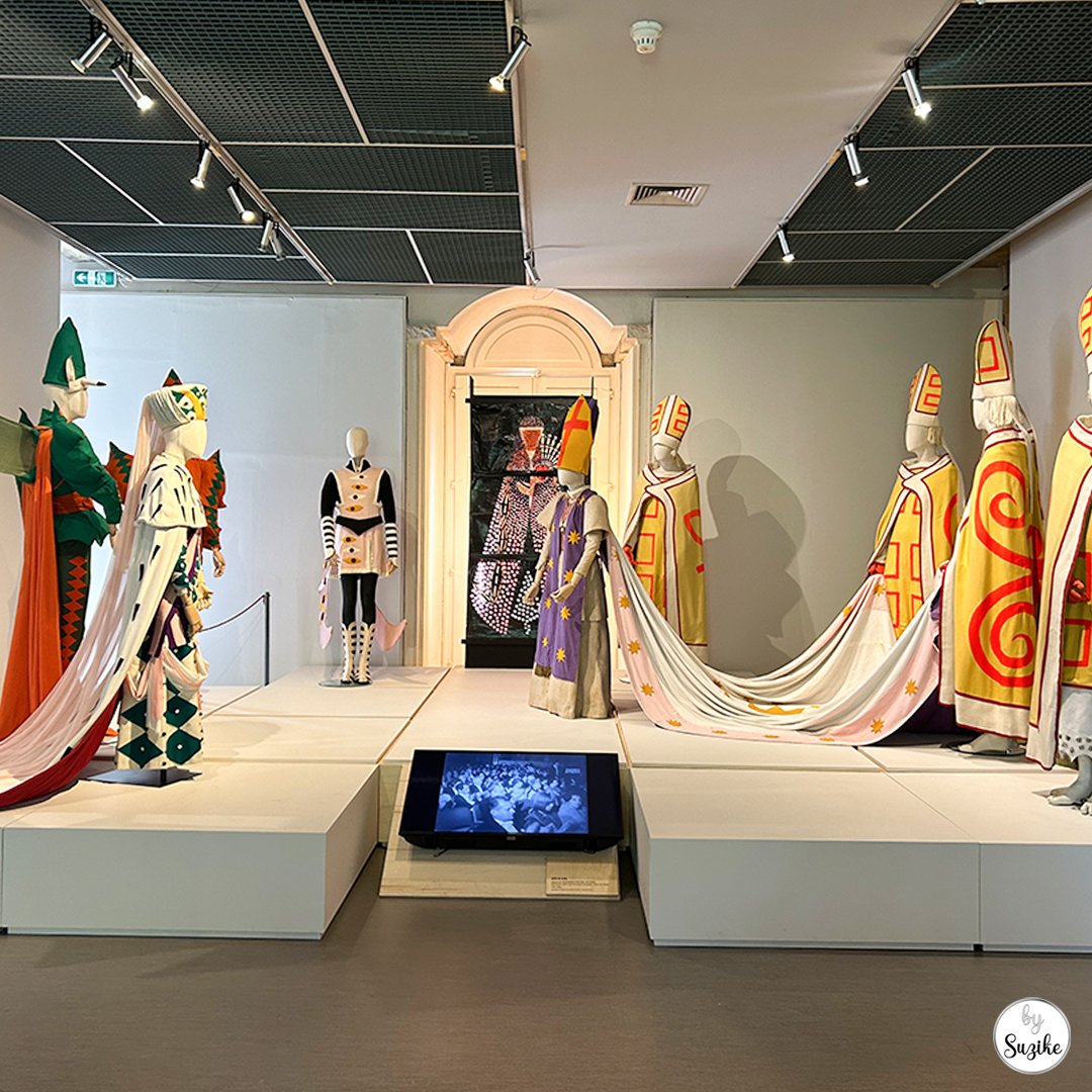 Costume gallery with mannequins and a central display at Monteiro Mor Park and Theatre Museum.