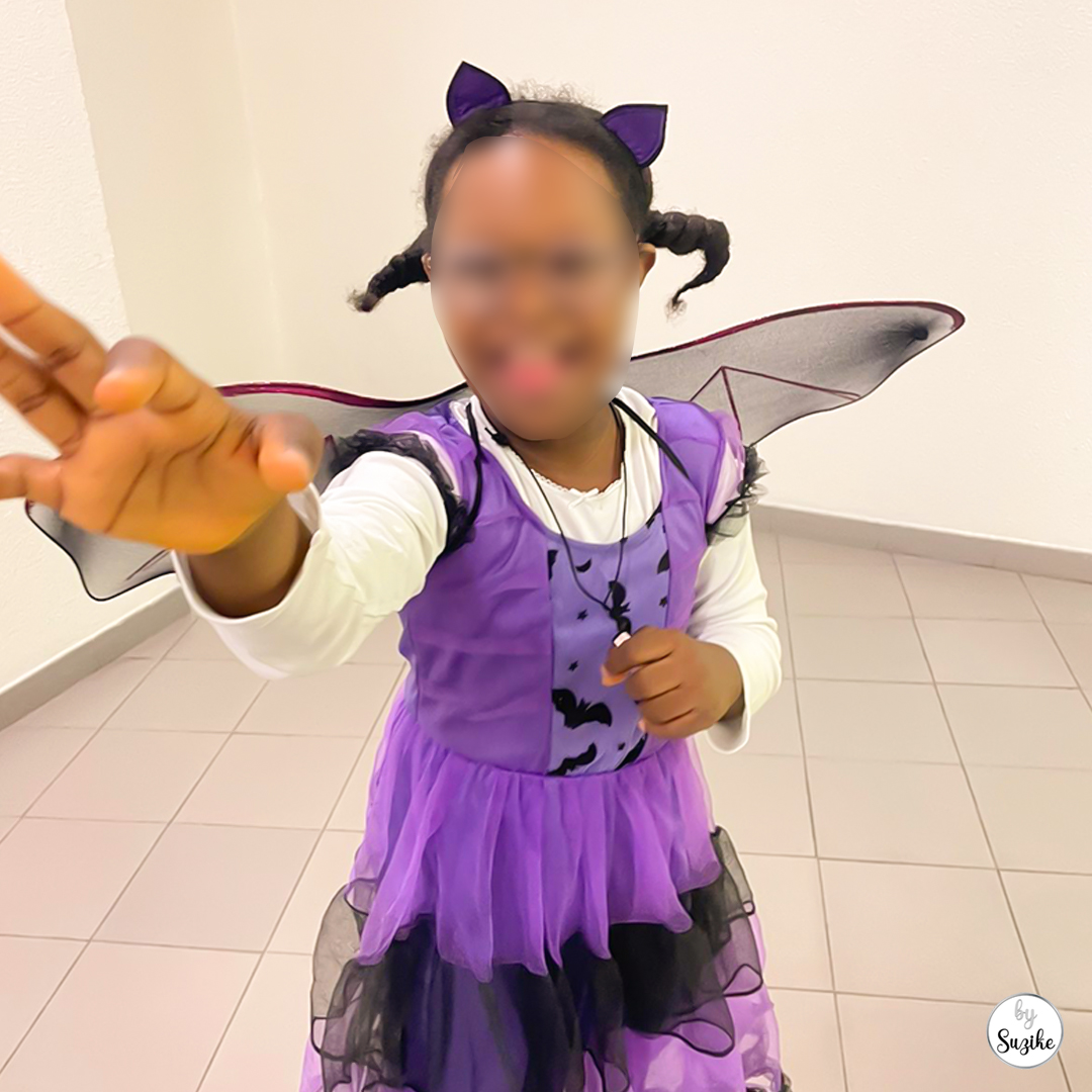 Bat costume for girls close-up real-life photo showing the dress, wings and headband.