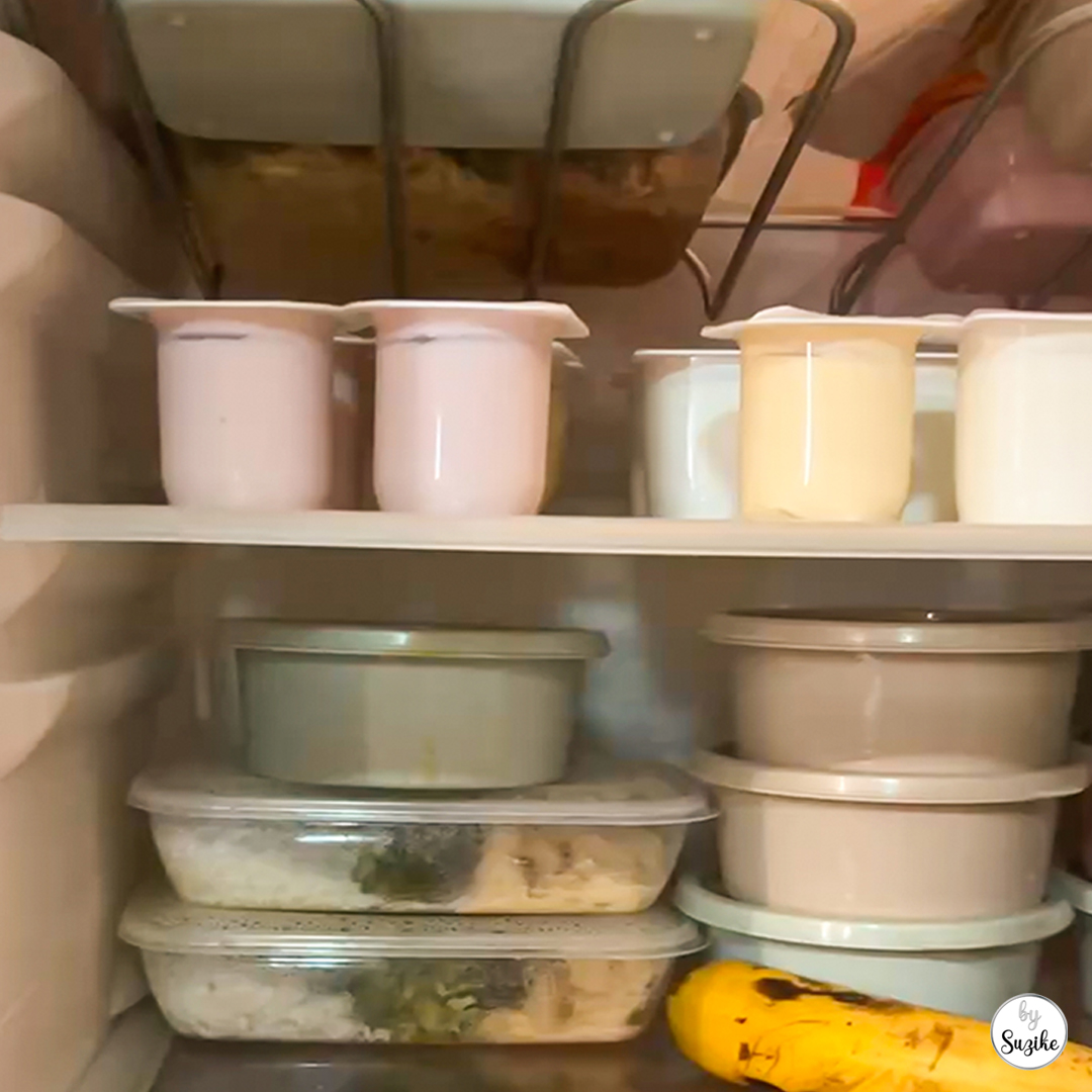 Best food storage containers review showing my meal prep containers stacked in my fridge for easy organization.