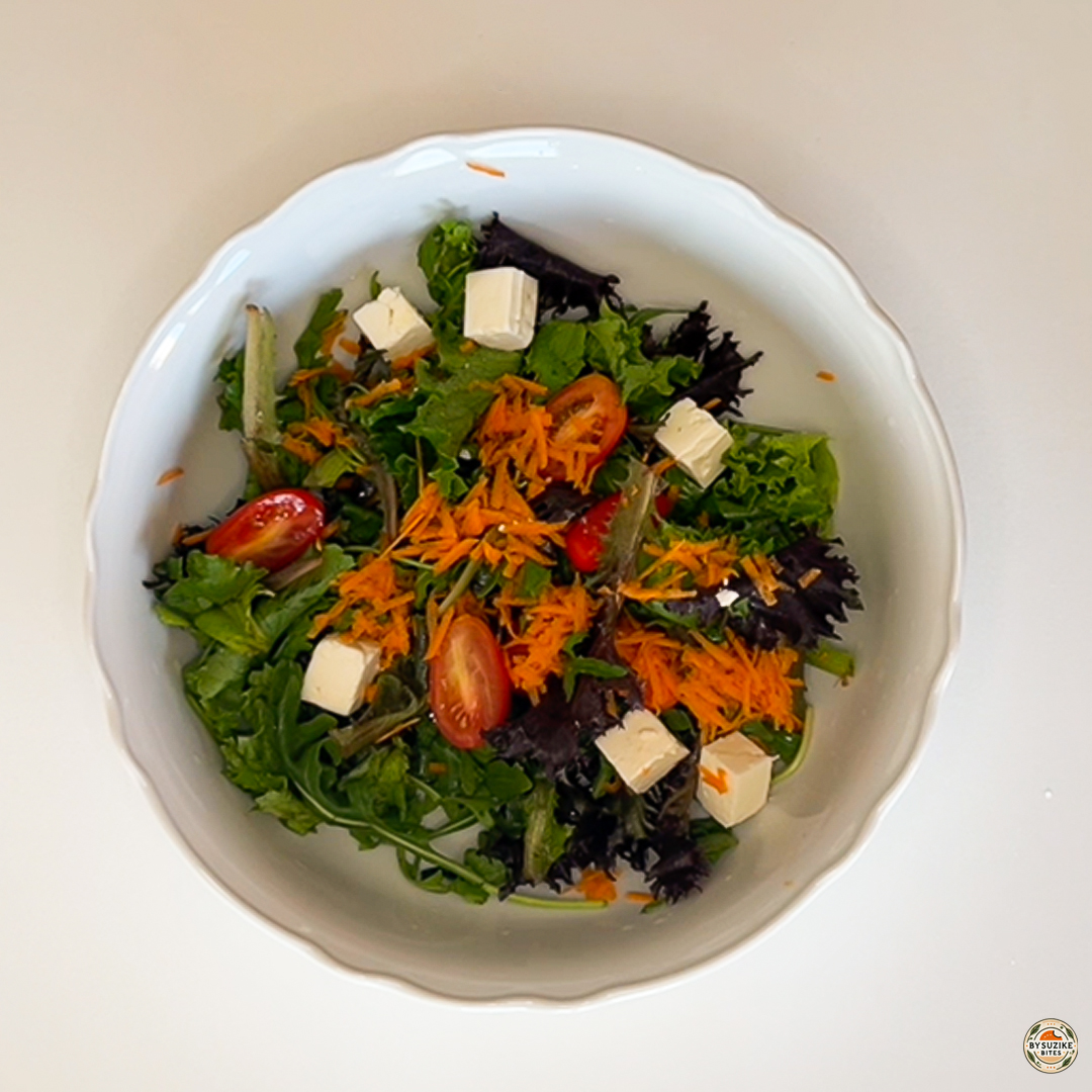 Egg salad with feta and mozzarella with mozzarella cubes added to the salad bowl.