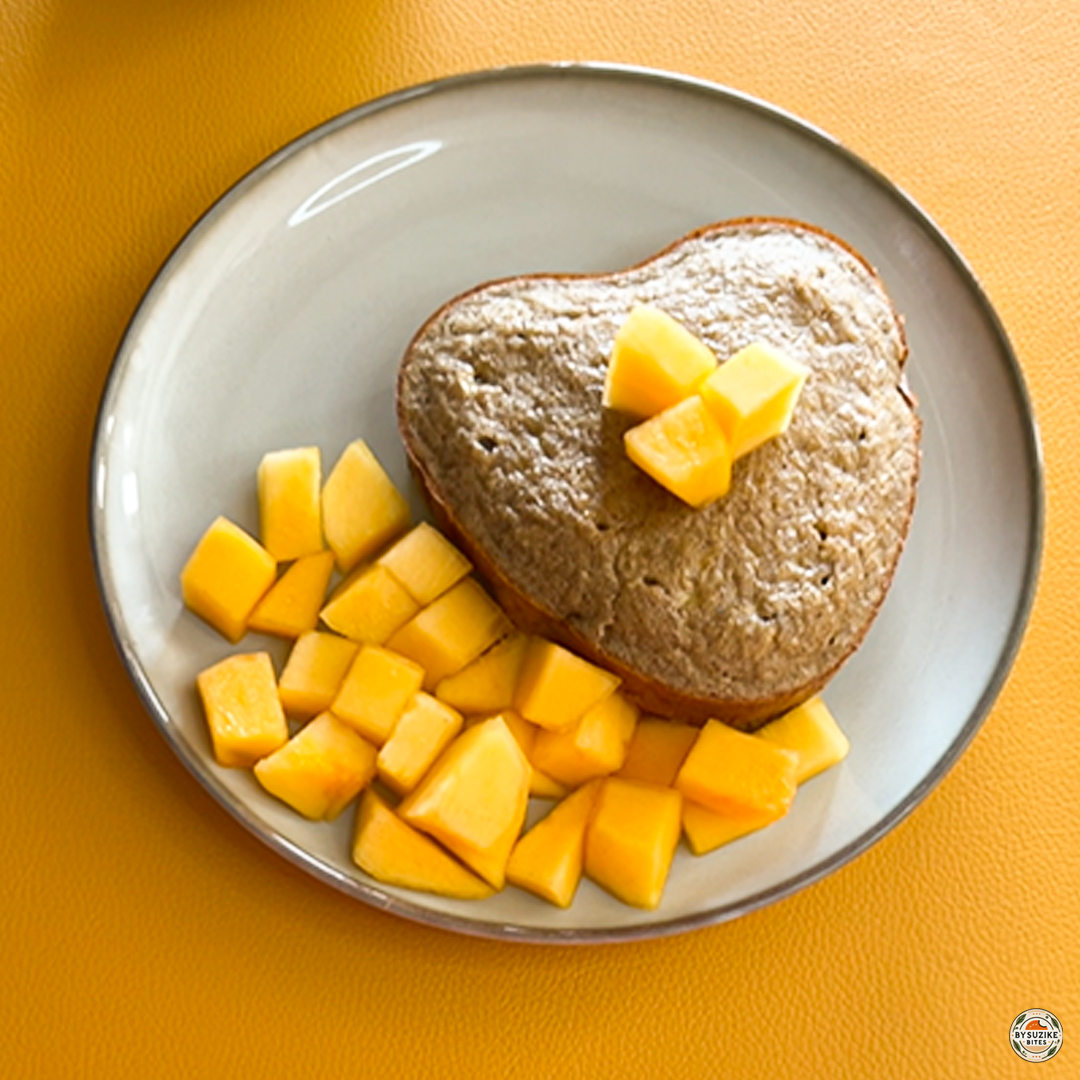 Fluffy banana oat cake served with fresh mango for breakfast thumbnail