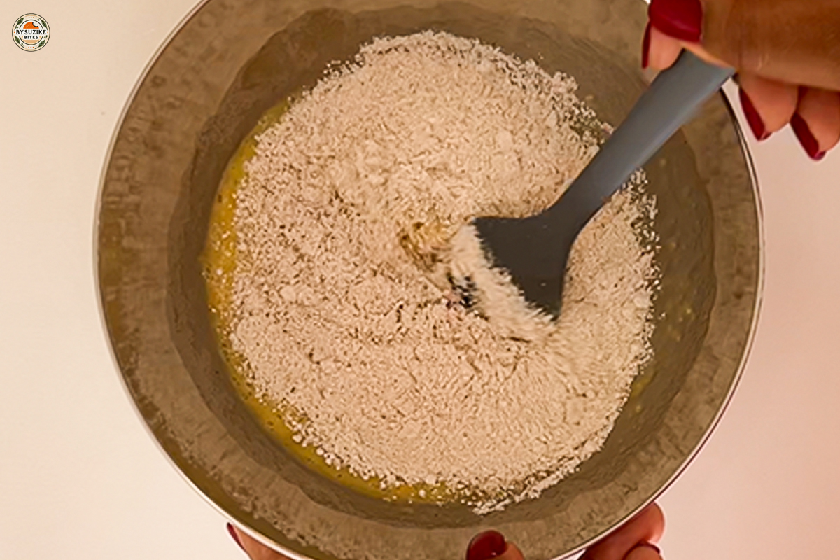 Mixing oat flour for fluffy banana oat cake batter.