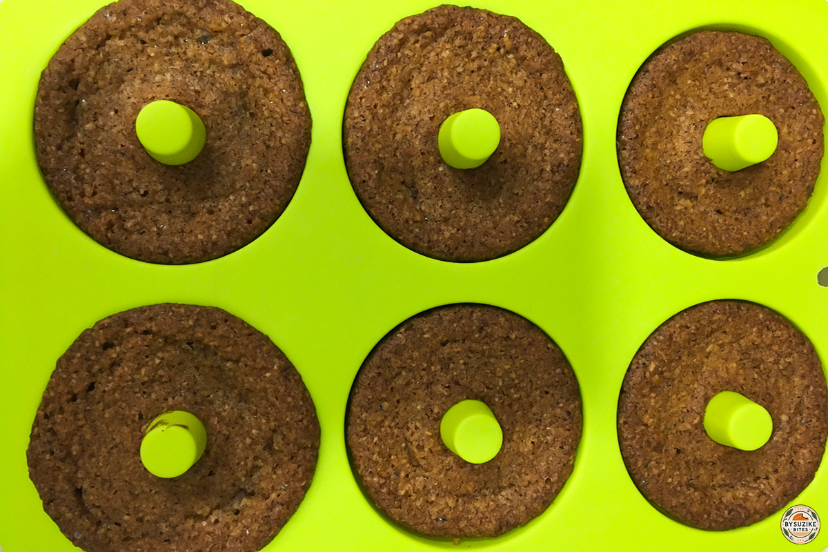 Keto cinnamon donuts baked in a silicone donut pan, top view