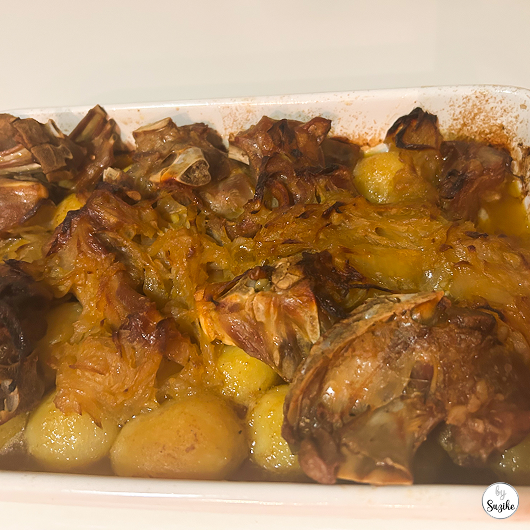 Pingo Doce Christmas dinner review Portugal, close up of cabrito assado and potatoes in the tray.