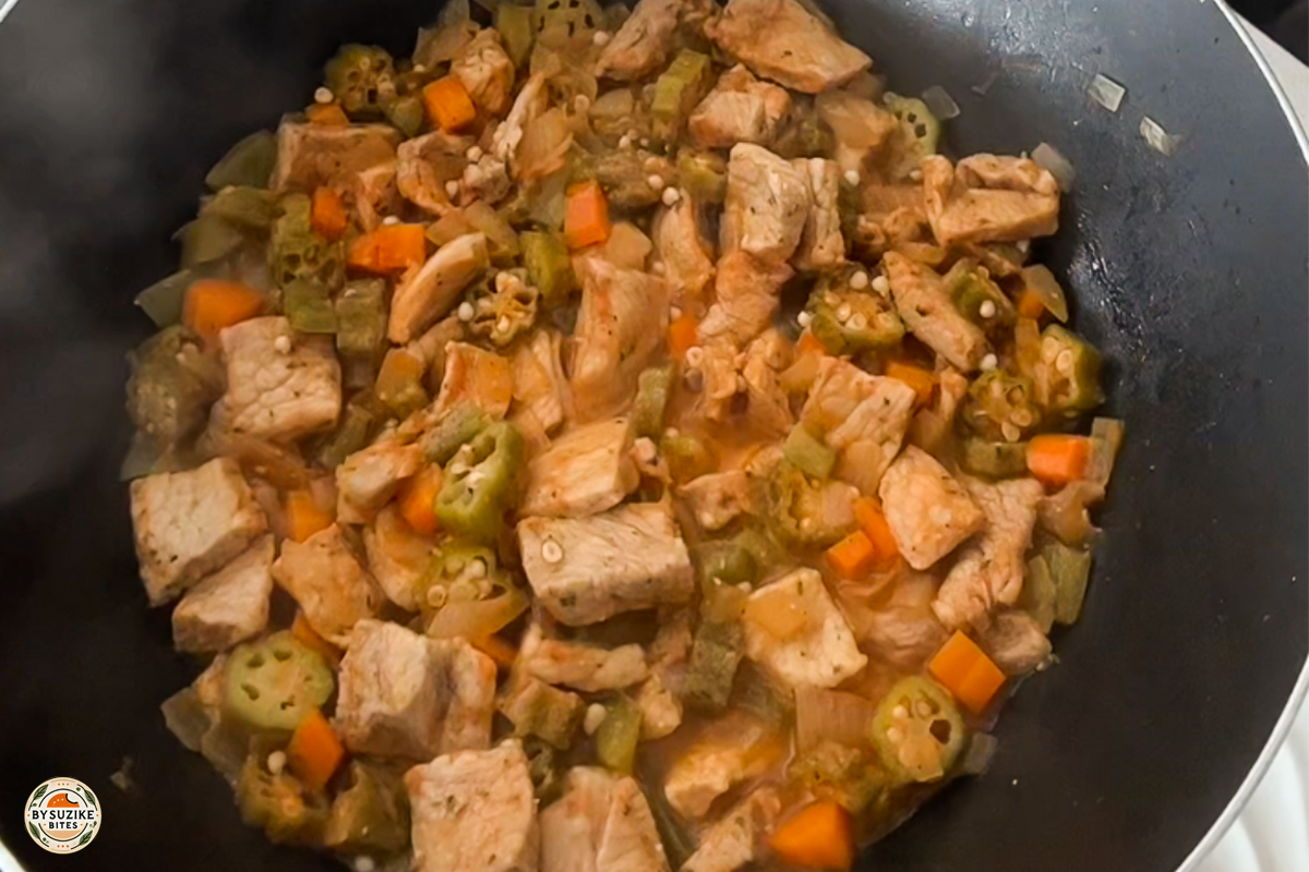 Step 11: Pork and okra stew simmering until tender
