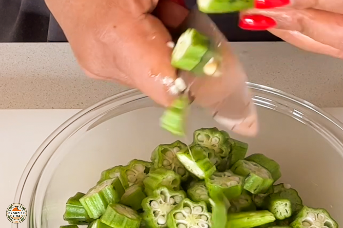 Step 5: Chopping fresh okra into slices for the stew
