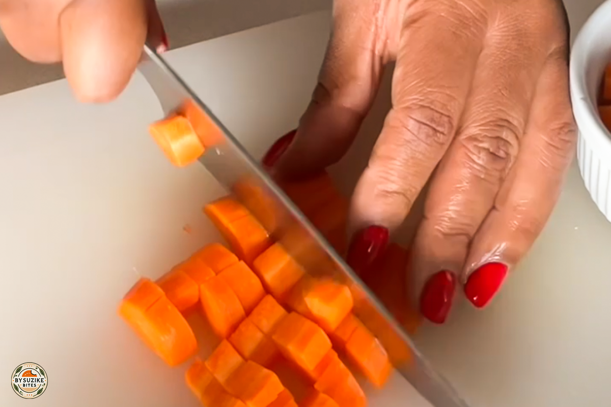 Step 8: Cutting a carrot into small cubes for the stew