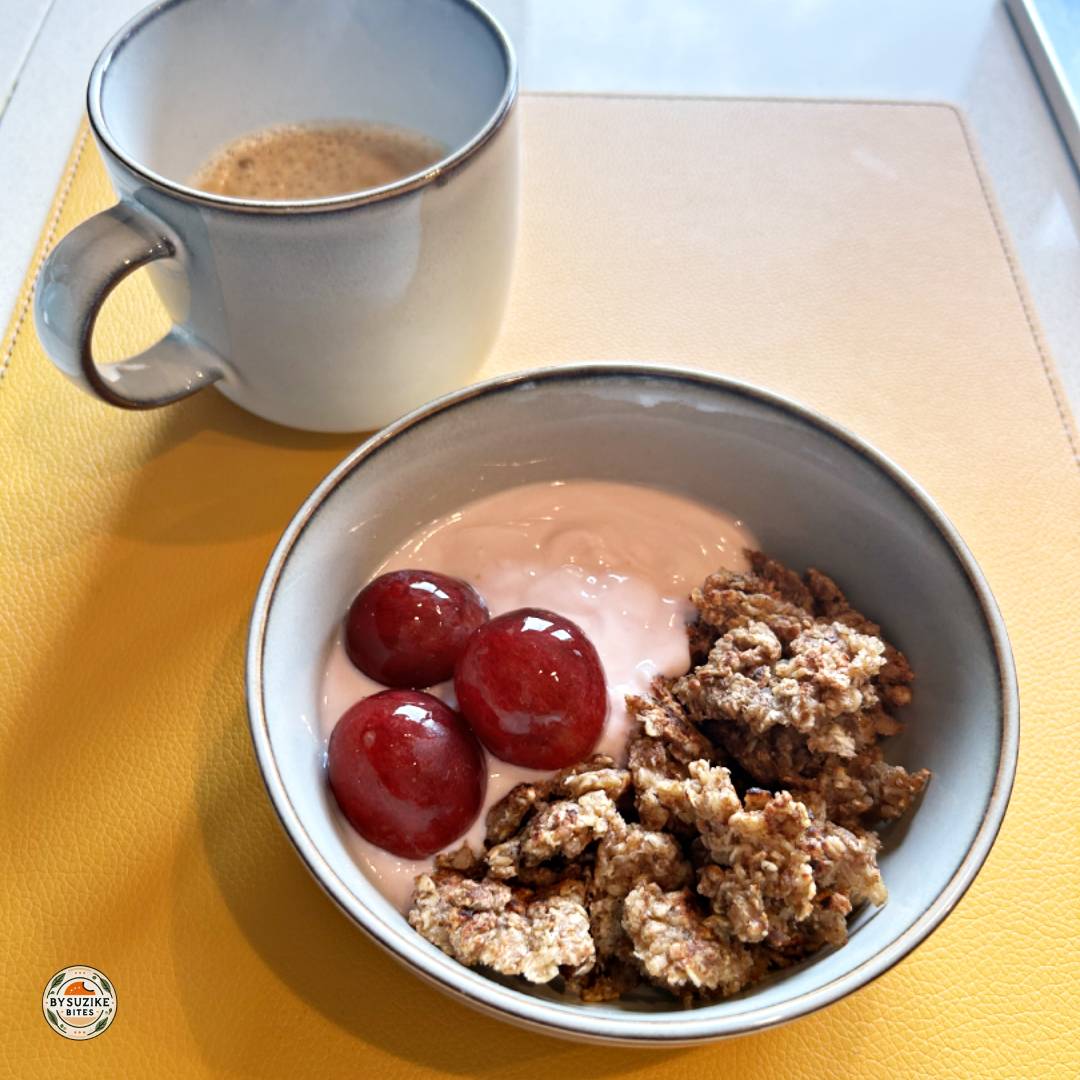strawberry yogurt breakfast bowl and cinnamon oat crumble served with coffee.