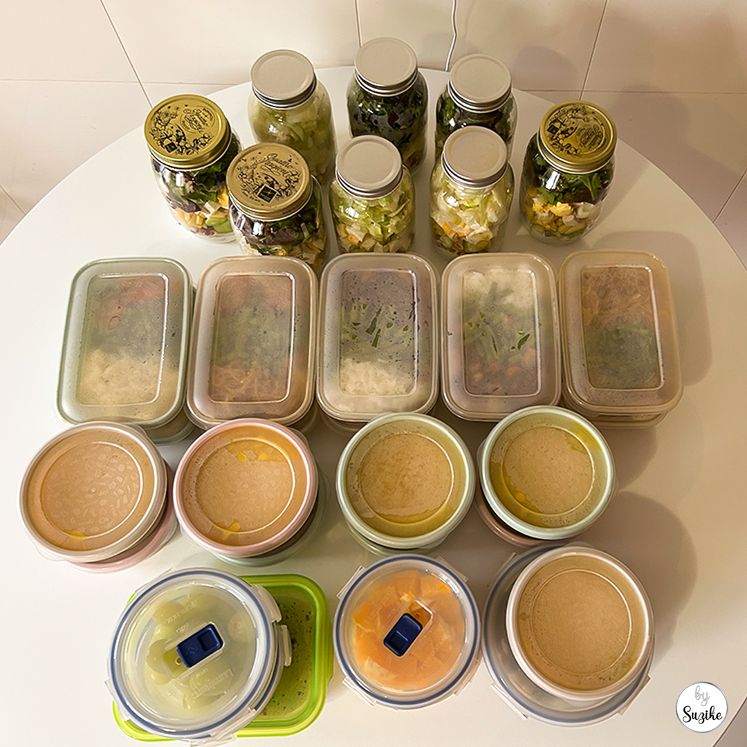 Weekly reset meal prep full spread showing jar salads, meal containers and snacks organised for the week.